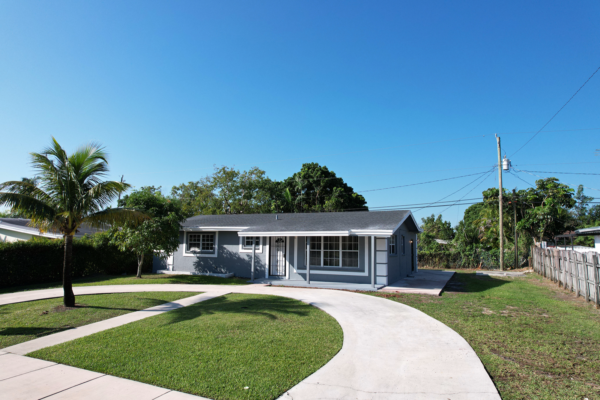 Single-family home in South Miami Heights, Miami-Dade with palm tree and front lawn
