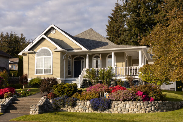 Family home with a front veranda and landscaping